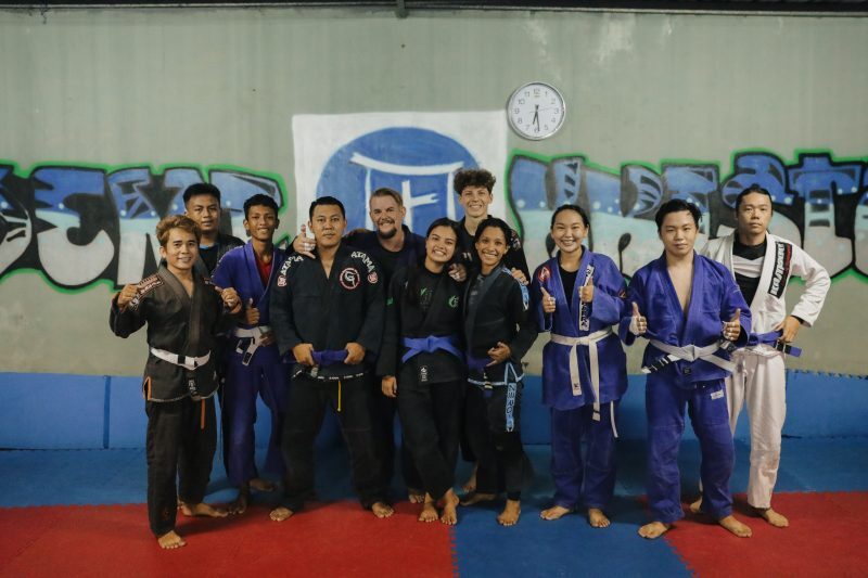 The team in gis on the mat at Akademi Kristus